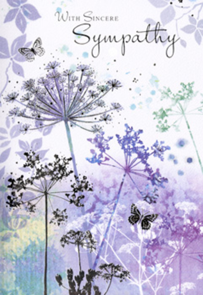 The artwork inside this sympathy card carries the same hushed comfort as stepping into a secluded corner of New Malden on a cool, still evening. From the lower edge of the card, tall, fine stems ascend, each crowned with an intricate spray of tiny blossoms that form classic umbelliferous flower heads. These delicate blooms are painted in layered tones of violet, soft mauve, and gentle blue, anchored by hints of muted green where the stems emerge. The flowers are not rendered with strict precision; instead, their edges blur subtly, blending into the softly textured background, which is awash with pale purples, silvery blues, and ghosted hints of foliage. This creates the impression of a quiet meadow or a thoughtful garden scene, similar to the calm you might find wandering home through local roads after sunset. Light on the card is subdued and diffused, creating a glow rather than sharp highlights, as if seen under a cloud-softened sky. Butterflies hover among the stems, some barely more than soft shapes with lightly tinted wings, their presence suggesting transformation, continued connection, and the fragile beauty of memory. The composition leaves open, breathable space above the floral silhouettes, a gentle canvas for words of sympathy to rest upon without feeling crowded. Each element-the colour palette, the fluid watercolour strokes, the poised stems-works together to create a sense of sincerity and compassion, echoing the care a New Malden florist at Flowers New Malden would take when helping families express condolence: quiet, respectful, and attuned to the deep emotions carried in such a simple but meaningful gesture.